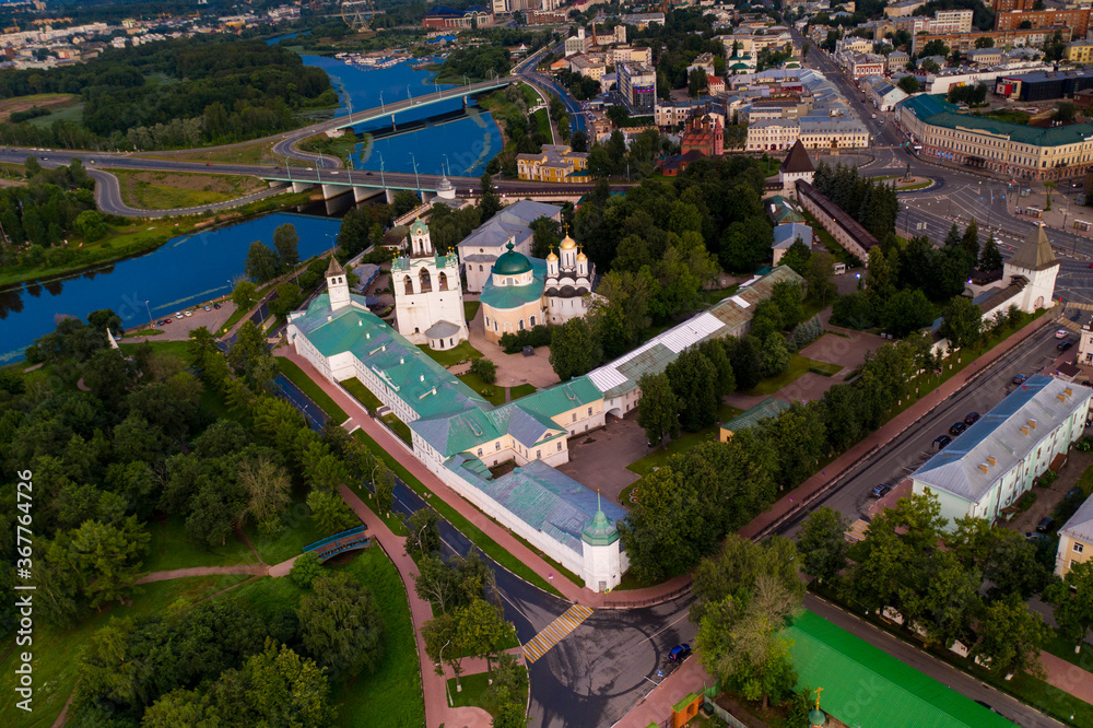 a panoramic view of the old fortress and church in the early morning at dawn filmed from a drone