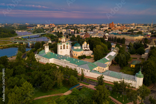 a panoramic view of the old fortress and church in the early morning at dawn filmed from a drone