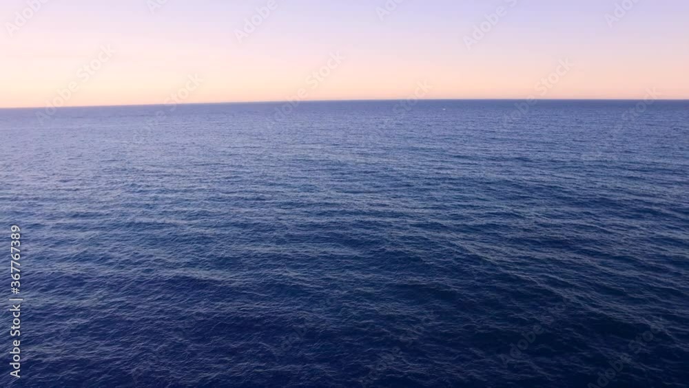 Sunset sea aerial view. Drone shot above ocean. Mediterranean sea, paradise, tropical exotic sea. Sea horizon. Moving away from the skyline. Sunset sea aerial view. Drone shot above ocean. Mediterranean sea, paradise, tropical exotic sea. Sea horizon. Moving away from the skyline.