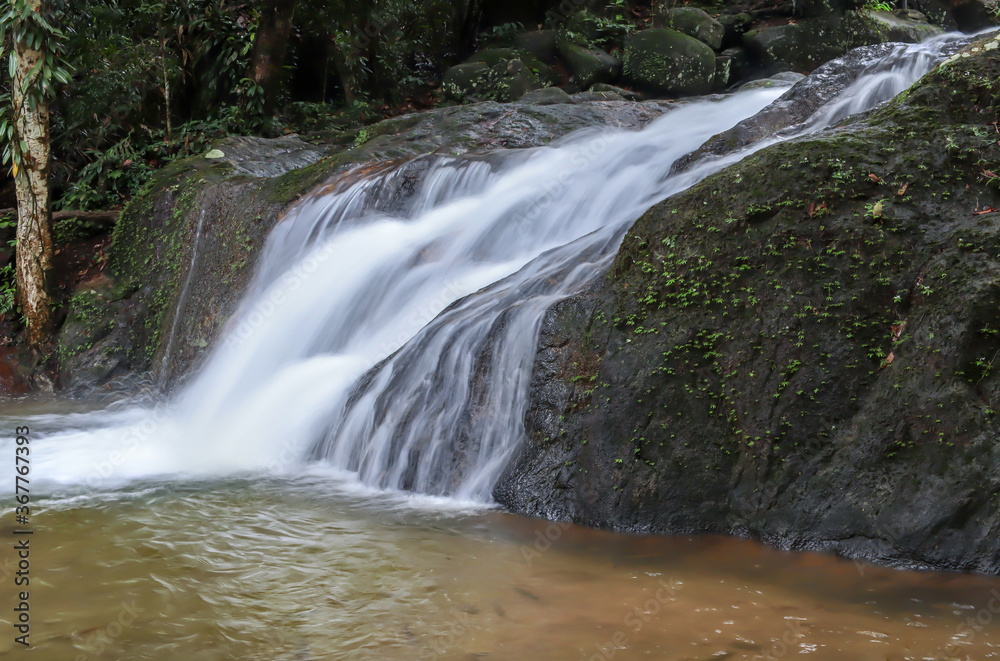 Naklejka premium Small waterfall on a rocky mountain