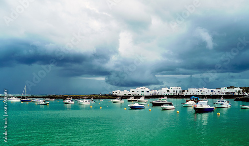 Orzola, Lanzarote, Canary Islands / Spain - March 10, 2011: Boats at the natural harbor