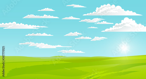 Beautiful landscape with green lawn and skyline with clouds, shining sun. Summer time, nobody. Greenery of summer. Summer scenery, horizontal view of rural scene. Calm nature, hot weather, morning
