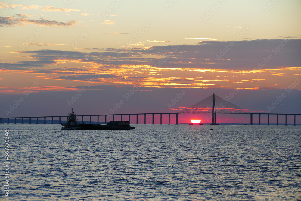 Sunset behind the Rio Negro river in Manaus, federal state Amazonas, Brazil.