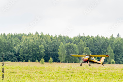 small aircraft. run-up of a private plane. takeoff of the plane. a small yellow plane. Tow plane. takeoff of the plane from the field