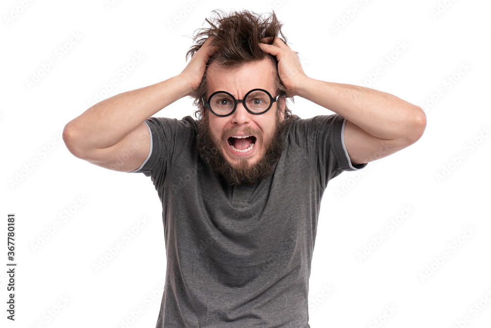 Crazy Scared or Shocked Bearded Man with funny Haircut in Eyeglasses looks Worried. Screaming Silly, Afraid or Surprised guy holding his Head, isolated on white background. Crazy Scared or Shocked Bearded Man with funny Haircut in Eyeglasses looks Worried. Screaming Silly, Afraid or Surprised guy holding his Head, isolated on white background.