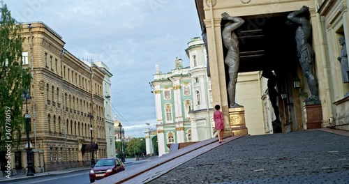 Woman and Titans on Millionnaya Street in Saint Petersburg near the Winter Palace of the Hermitage photo