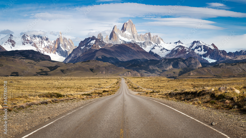 Panoramic view of the main street leading to the great mountains of Cerro Torre and Fitz Roy in El Chalten, Argentina Panoramic view of the main street leading to the great mountains of Cerro Torre and Fitz Roy in El Chalten, Argentina