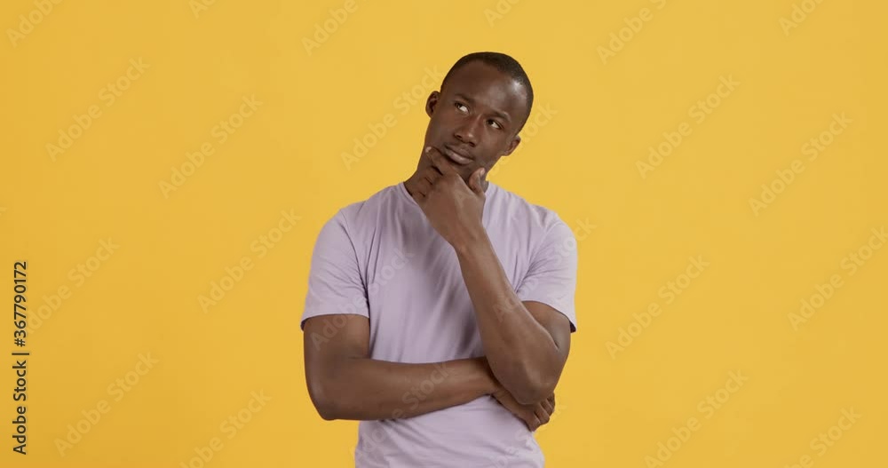 Black man thinking about problem solution, orange background