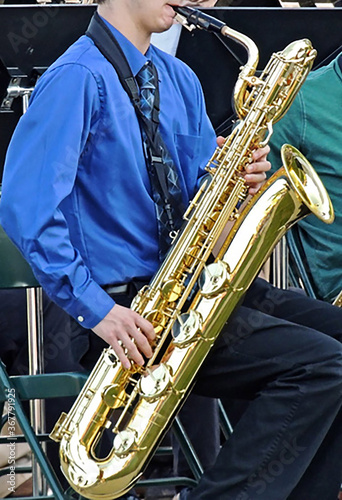 young man playing Bari saxophone at a Jazz concert