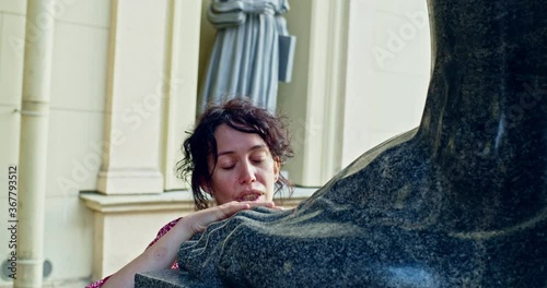 Woman and Titans on Millionnaya Street in Saint Petersburg near the Winter Palace of the Hermitage photo