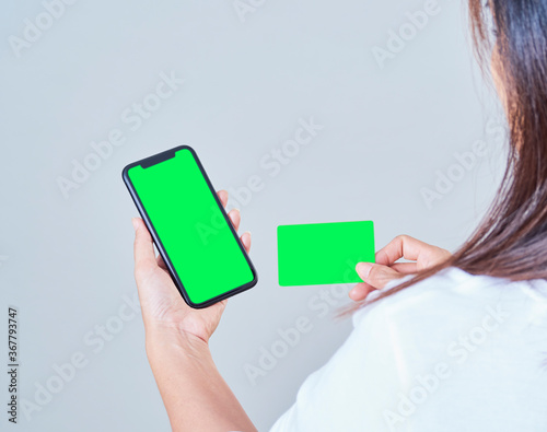 Woman with smartphone and credit card