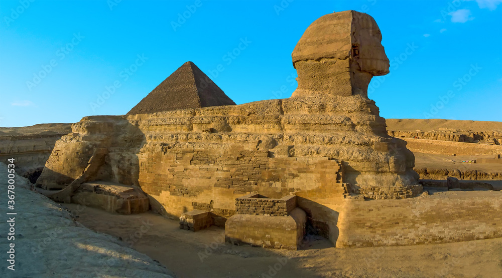 A panorama view of the Great Sphinx at Giza, Egypt silhouetted in the evening sunshine in summer