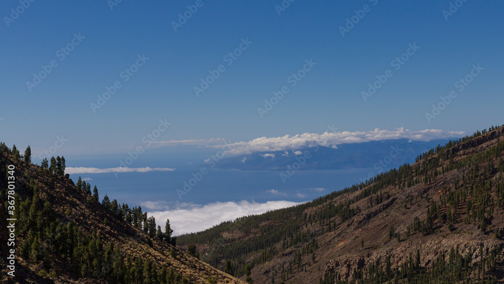 scenic view with on island Teneriffe with clouds down in the valley