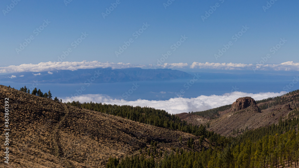wide angle view with dark blue sky on island Teneriffe above the clouds