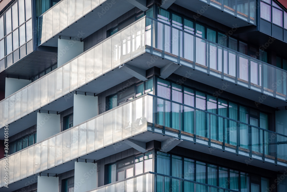 Glass balconies in a tall, luxurious building Glass balconies in a tall, luxurious building