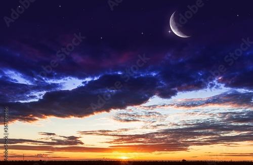 Ramadan background with a crescent and sunset sky . beautiful dawn in the morning