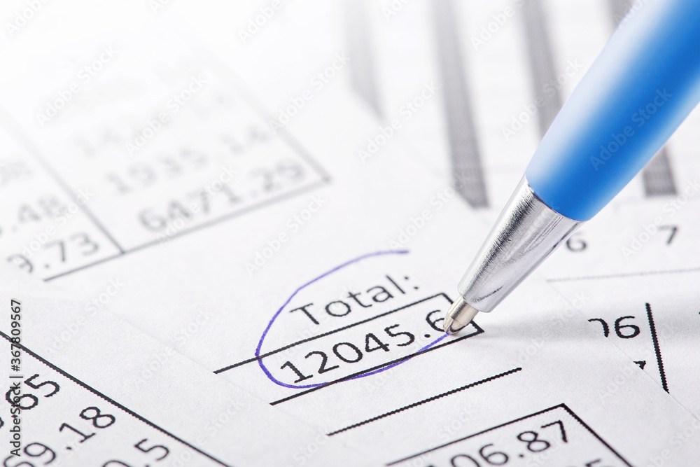 Accounting document with pen and checking financial chart. Concept of banking, financial report and financial audit. Accounting document with pen and checking financial chart. Concept of banking, financial report and financial audit.