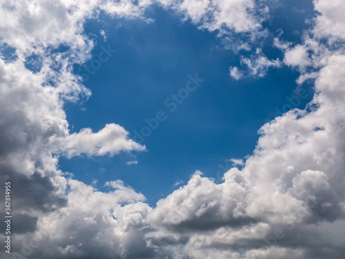 Hole of blue sky in the fluffy clouds in the sky © Pavel Rumlena