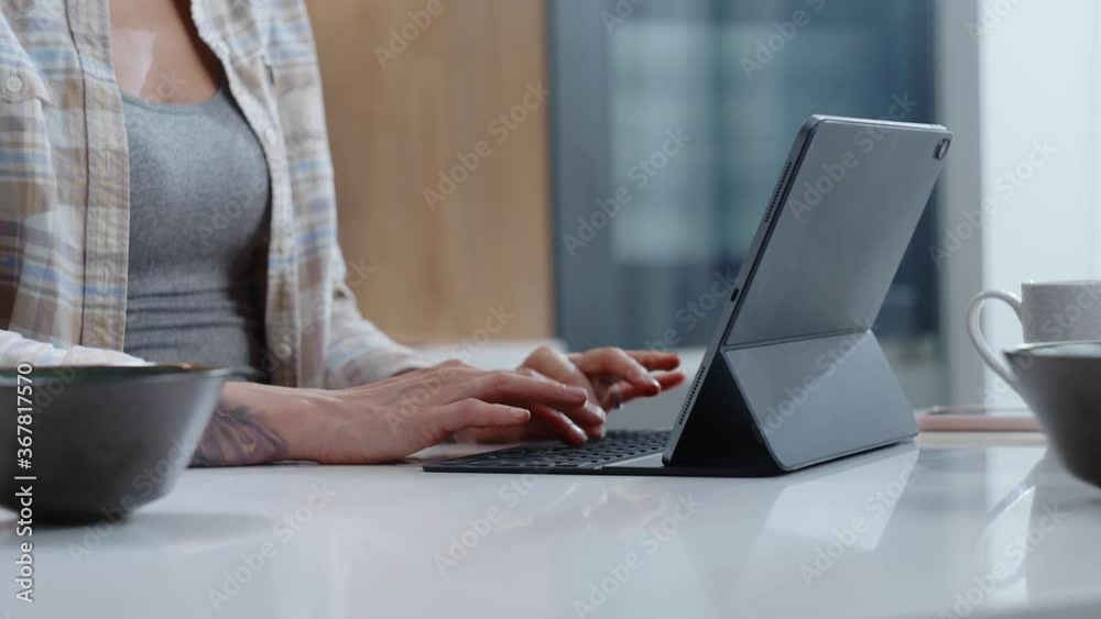 Woman Make Notes on Modern Tablet at Home. Woman Make Notes on Modern Tablet at Home.