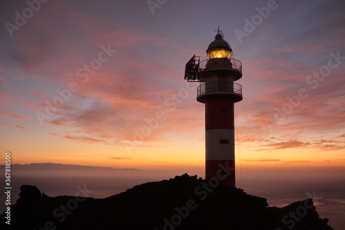 Buenavista del Norte, Santa Cruz de Tenerife/Spain; Oct. 10, 2011. Sunset at the Punta de Teno Lighthouse, with the island of La Gomera in the background.