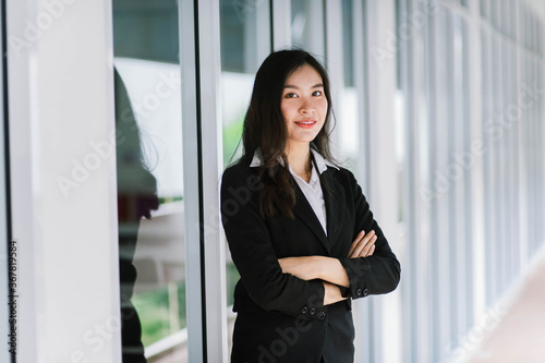 Free Download A smiling Asian business woman in white shirt crossed her arms - GFXLoad