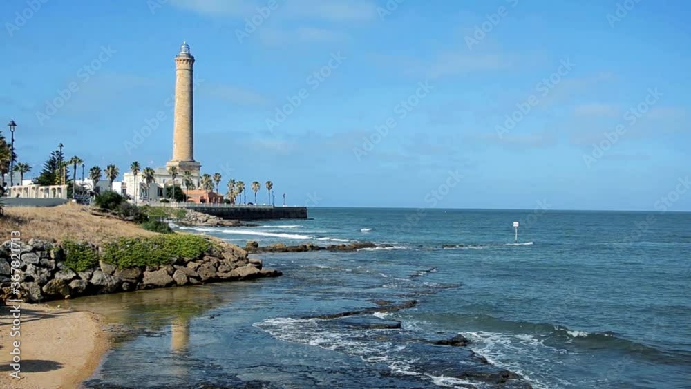 Maritime landscape about the lighthouse and the beach of Chipiona in Cadiz, Spain Maritime landscape about the lighthouse and the beach of Chipiona in Cadiz, Spain