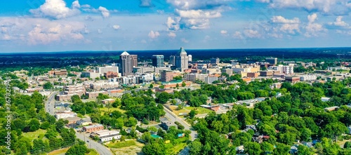 Aerial shot of the skyline of Greensboro located in North Carolina, USA, on a partly cloudy day