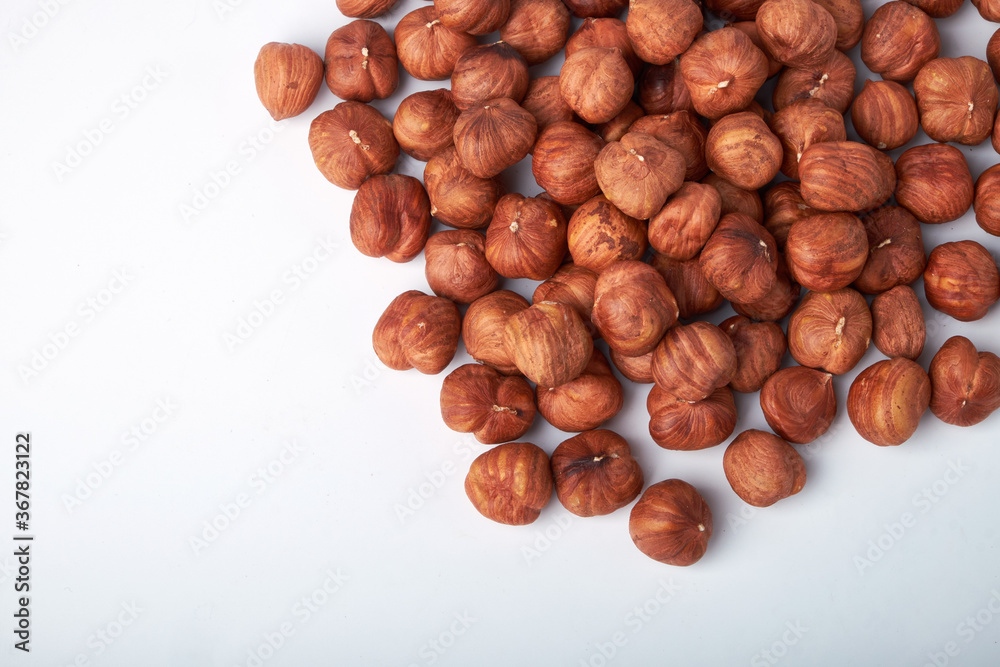 hazelnuts in a Cup on a white background hazelnuts in a Cup on a white background