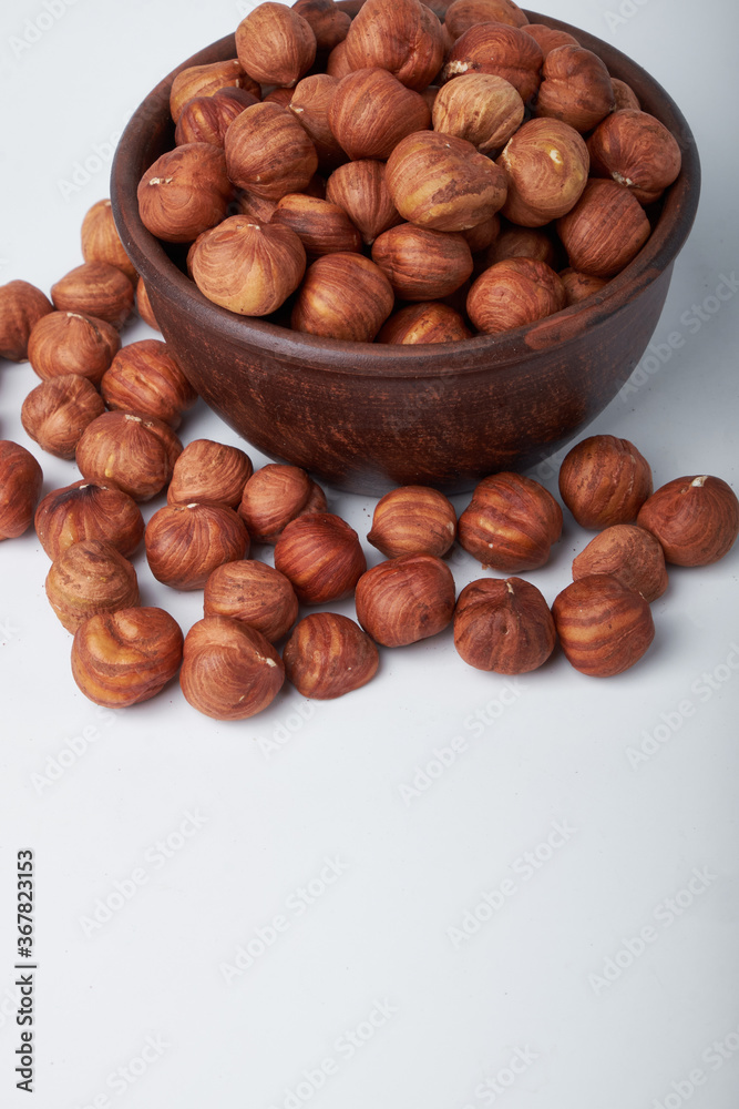 hazelnuts in a Cup on a white background hazelnuts in a Cup on a white background