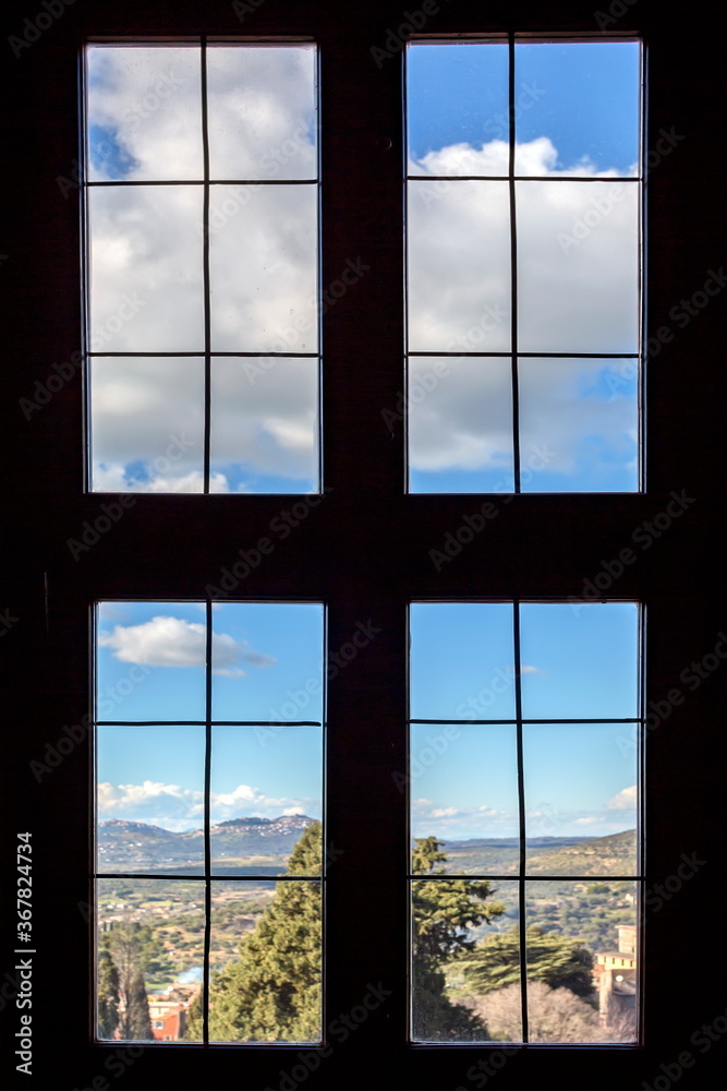 Outside the window you can see a beautiful landscape with clouds Outside the window you can see a beautiful landscape with clouds