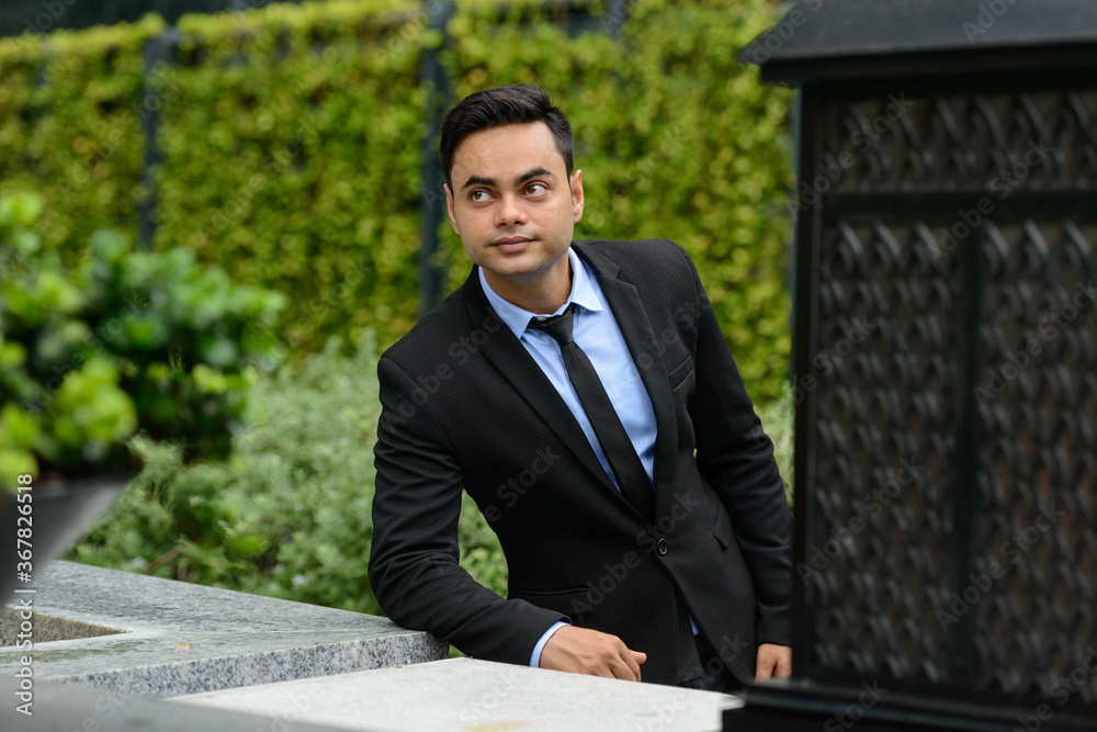 Young handsome Indian businessman in the city Young handsome Indian businessman in the city