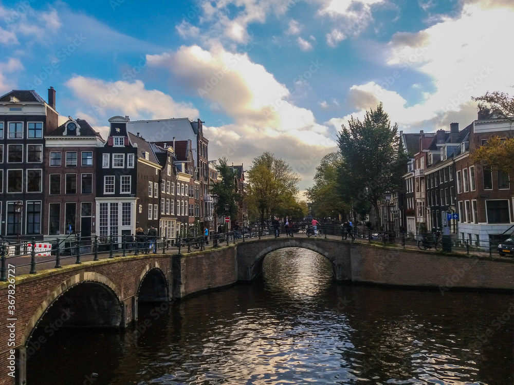 Around the canals of Amsterdam, seeing bridges, buildings, towers and all things of this beautiful city