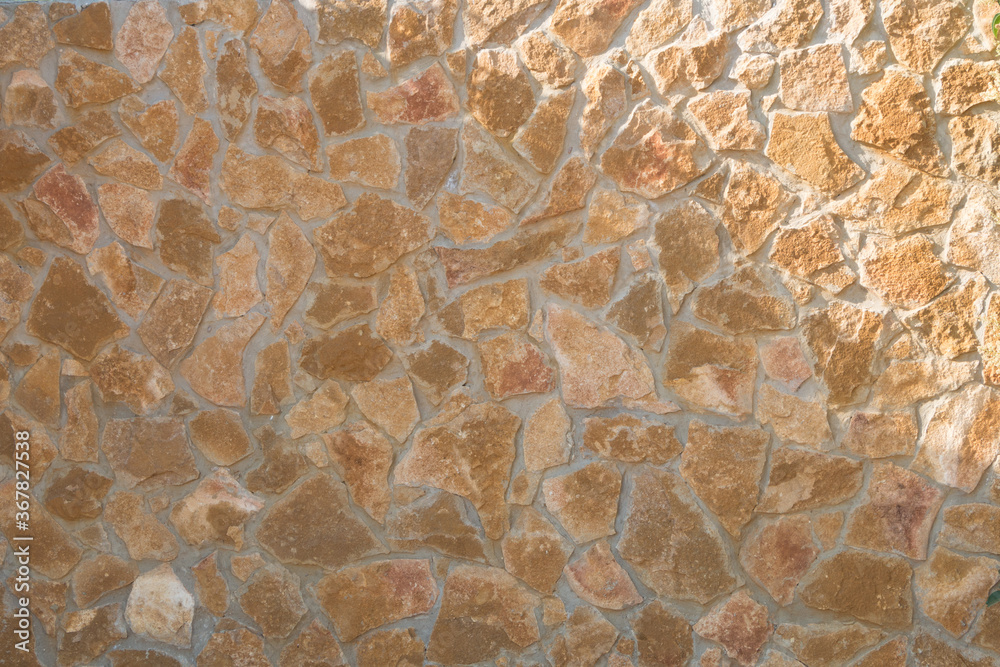 Natural stone wall on concrete