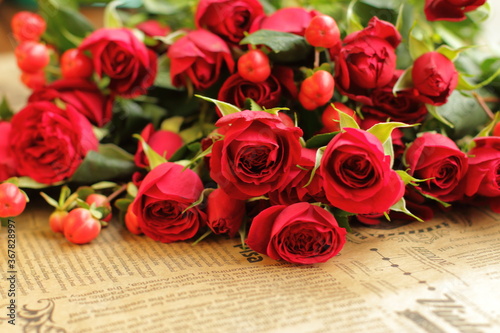 red roses on decorated paper 