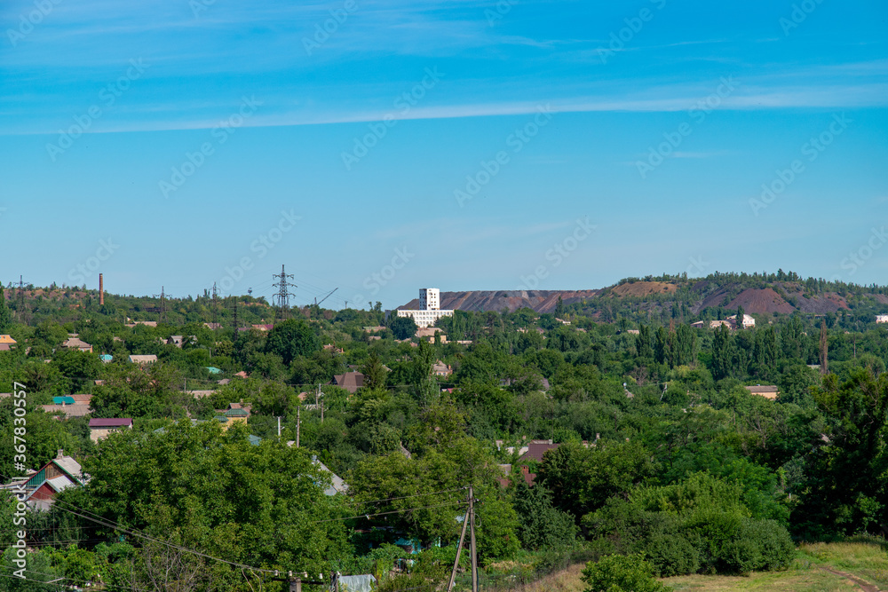 Ukraine, Krivoy Rog, the 16 of July 2020. View on the city from the old mining dump. Country cottage area down below. 