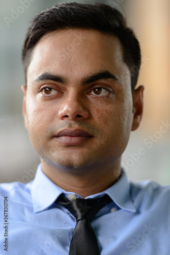 Young handsome Indian businessman in the city © Ranta Images