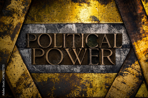 Political Power text formed with real authentic typeset letters on vintage textured silver grunge copper and gold background