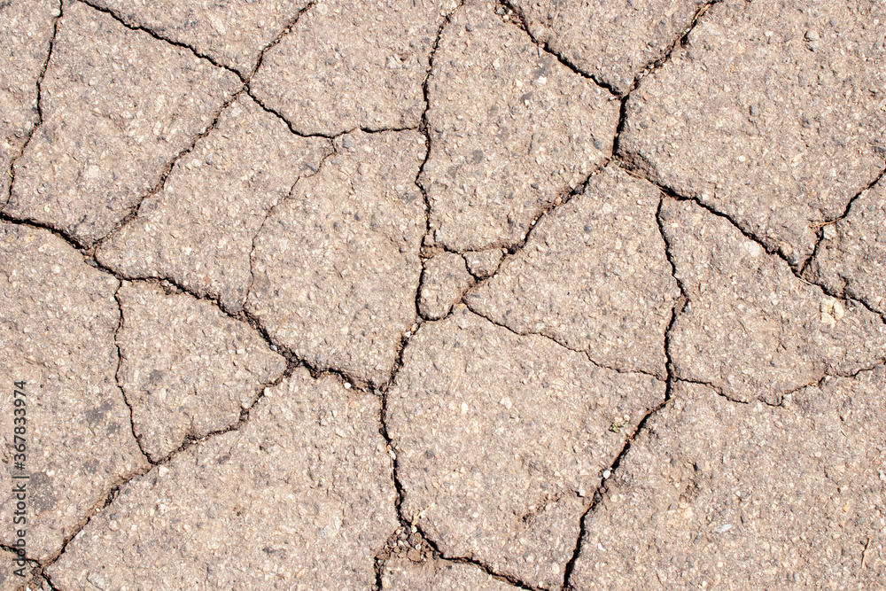 Cracked asphalt texture. Abstract asphalt background Cracked asphalt texture. Abstract asphalt background