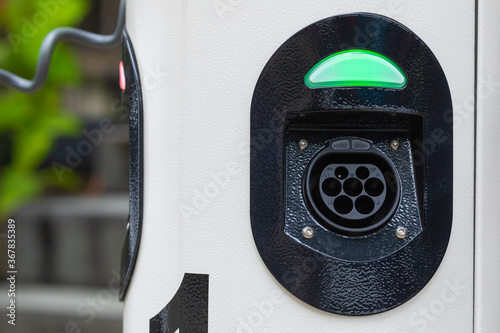 Canvas Print Electric car charging station at street level in Singapore, Southeast Asia