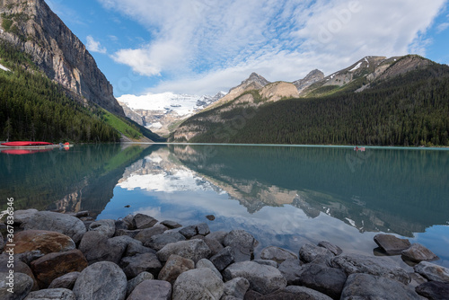 Lake Louise on a sunny day with beautiful reflections in the water