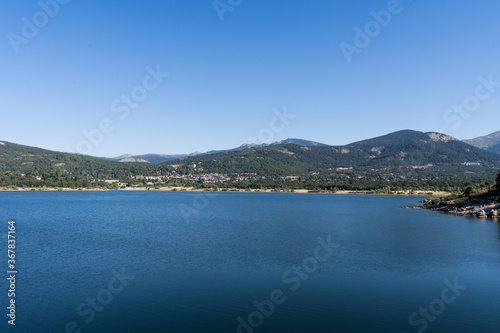 Panoramic view of the lake and mountains from a water reservoir in Navacerrada
