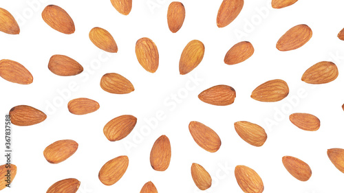 Almond flying in circles around copy space, isolated on white