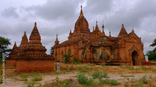 An old temple ruin reaching to a cloudy sky.