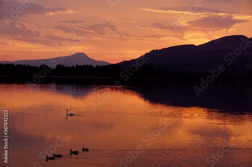 sunset over The lake of Menteith In Scotland.