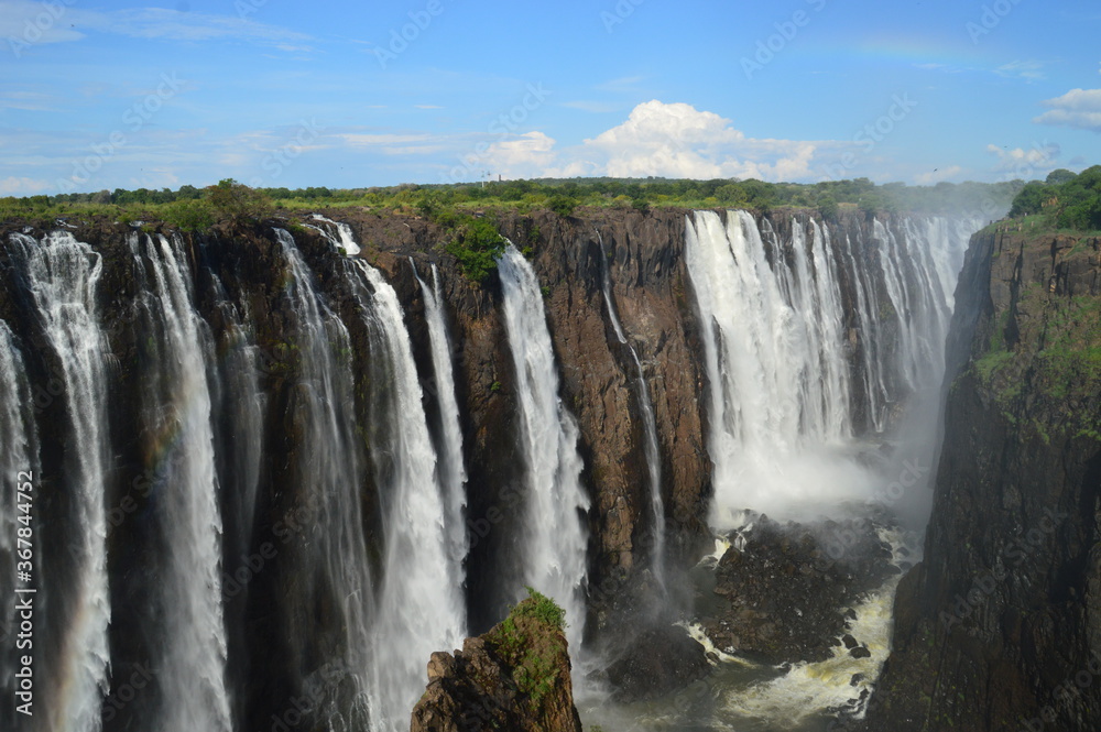 The massive Victoria Falls waterfalls between Zimbabwe and Zambia in Southern Africa The massive Victoria Falls waterfalls between Zimbabwe and Zambia in Southern Africa