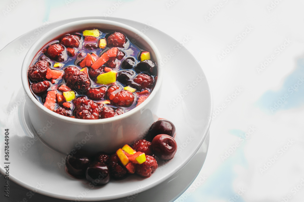 Fruit salad and juice on sky background. Healthy breakfast concept. Fruit salad and juice on sky background. Healthy breakfast concept.