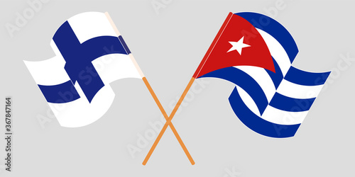 Crossed and waving flags of Cuba and Finland