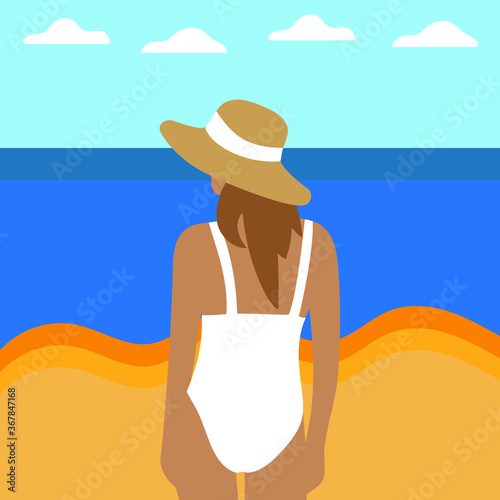 Young woman in a white swimsuit on the beach