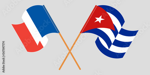Crossed and waving flags of Cuba and France