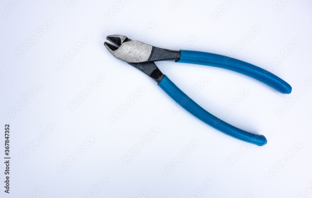 Metal wire cutters with blue handles on a white background.Hand tools. Metal wire cutters with blue handles on a white background.Hand tools.